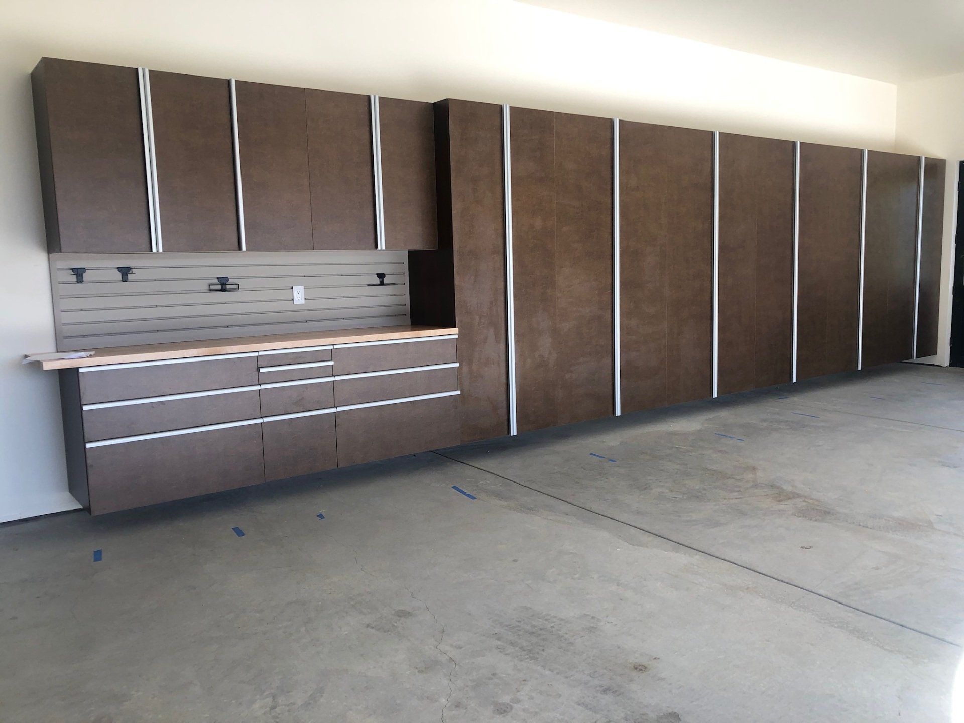 A kitchen with a lot of cabinets and drawers
