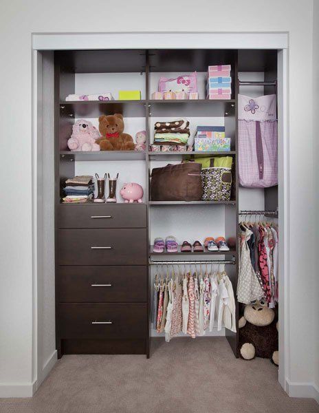 A child 's closet filled with clothes and stuffed animals