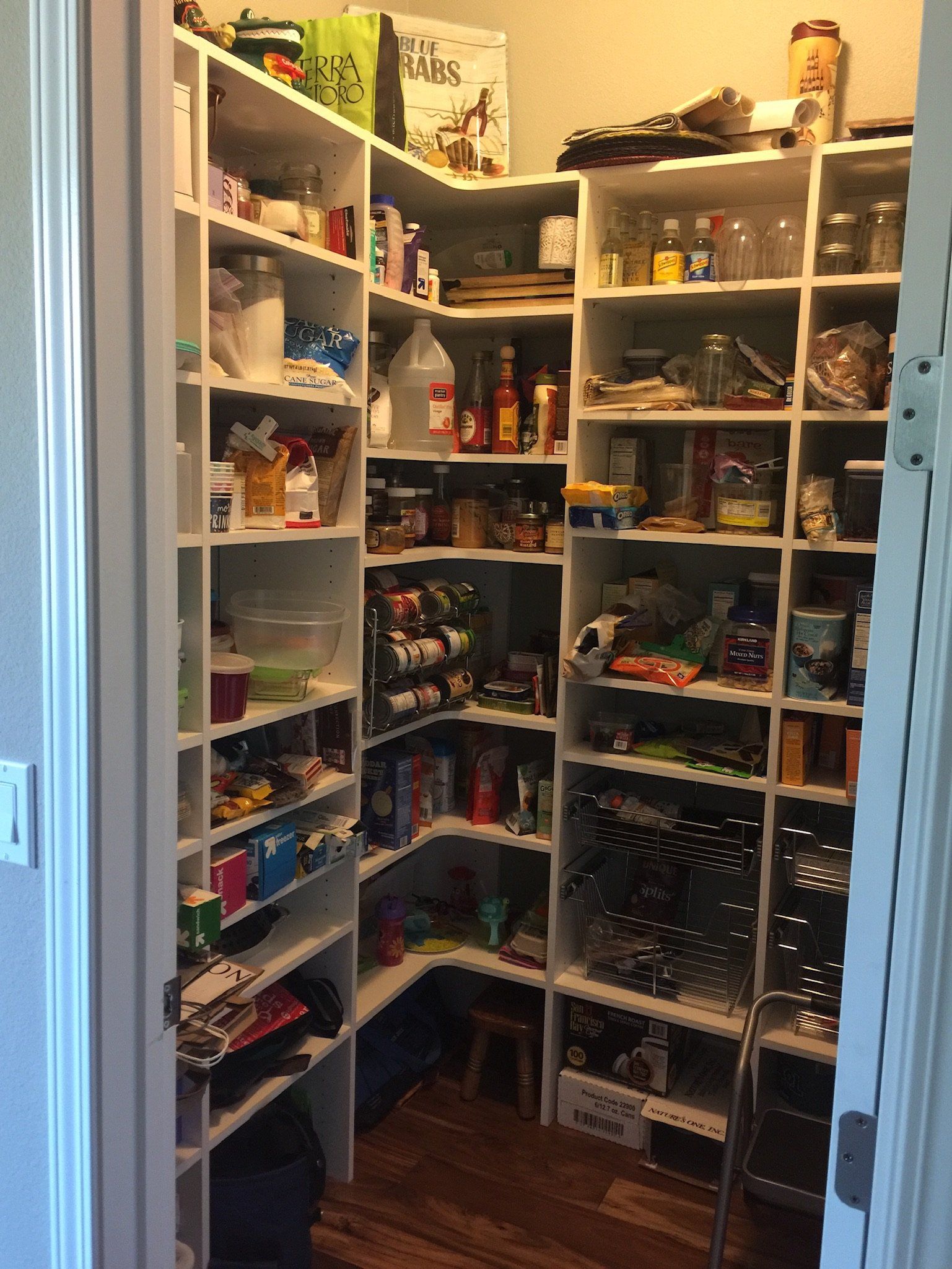 A pantry filled with lots of food and bottles