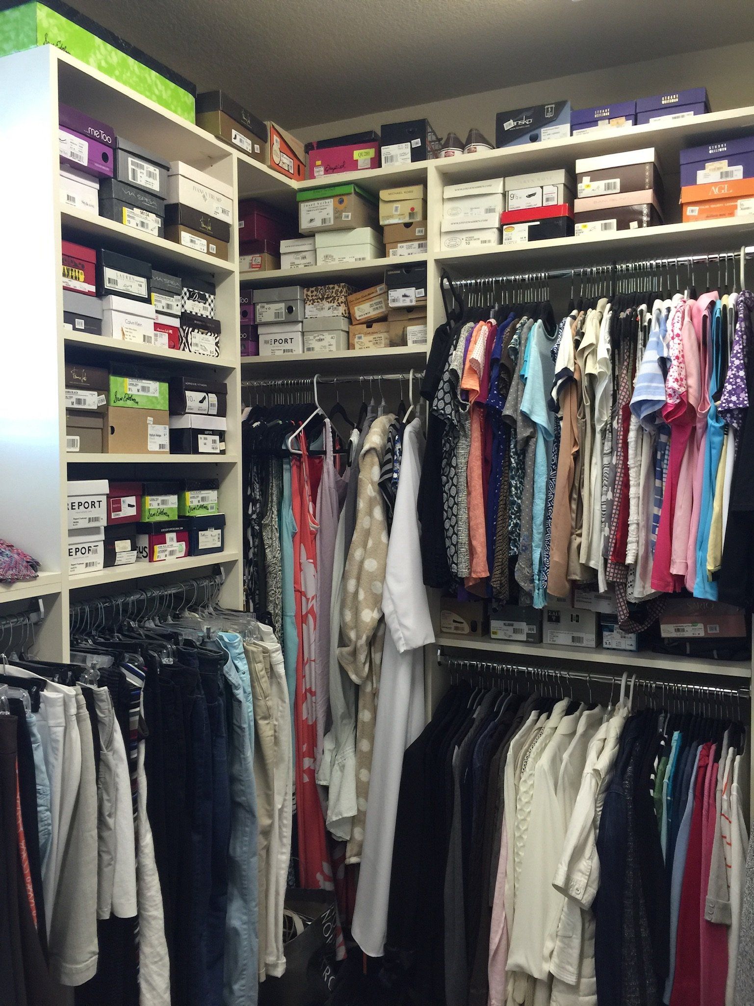 A closet filled with lots of clothes and shoes