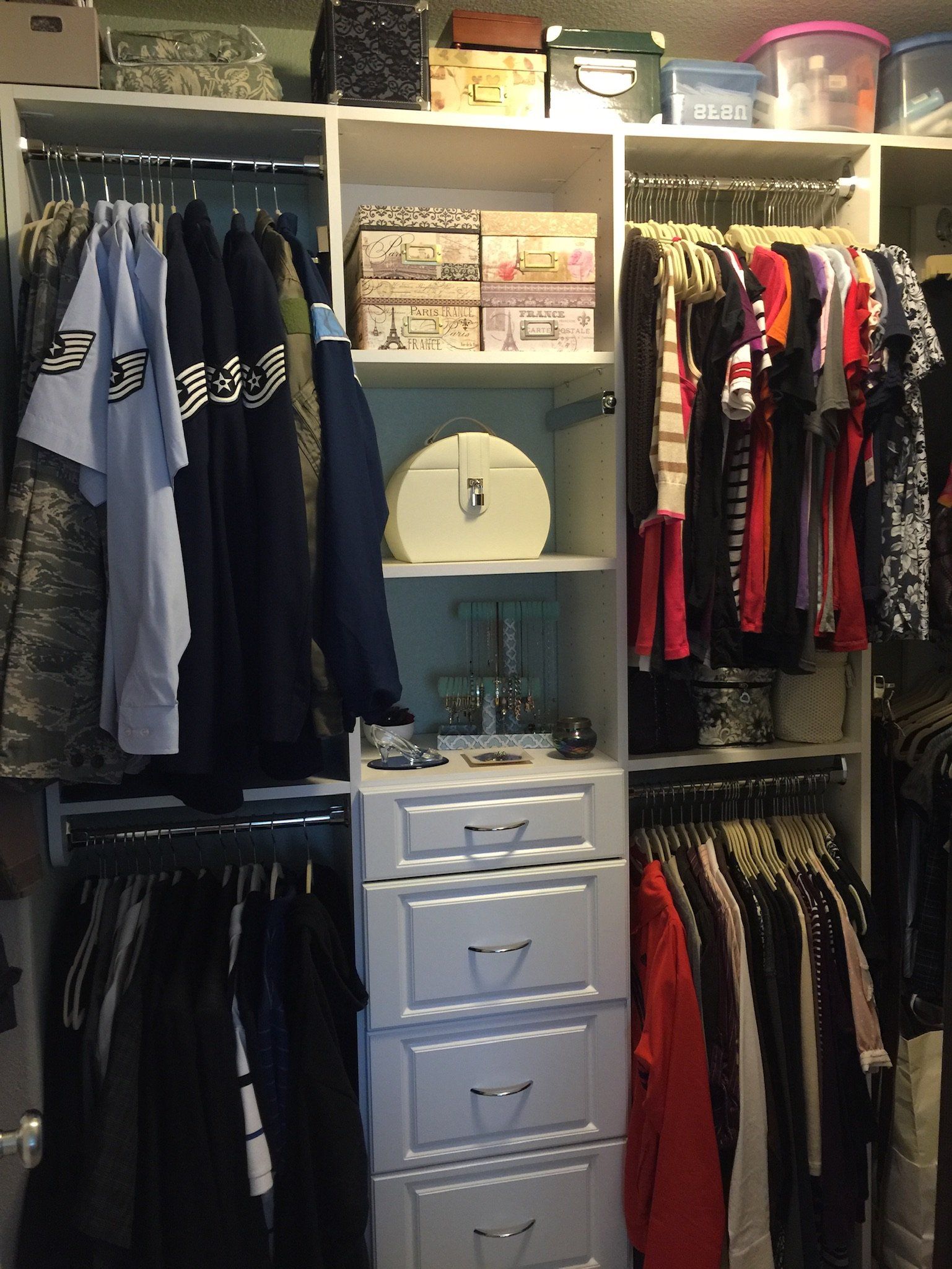 A closet filled with lots of clothes and drawers