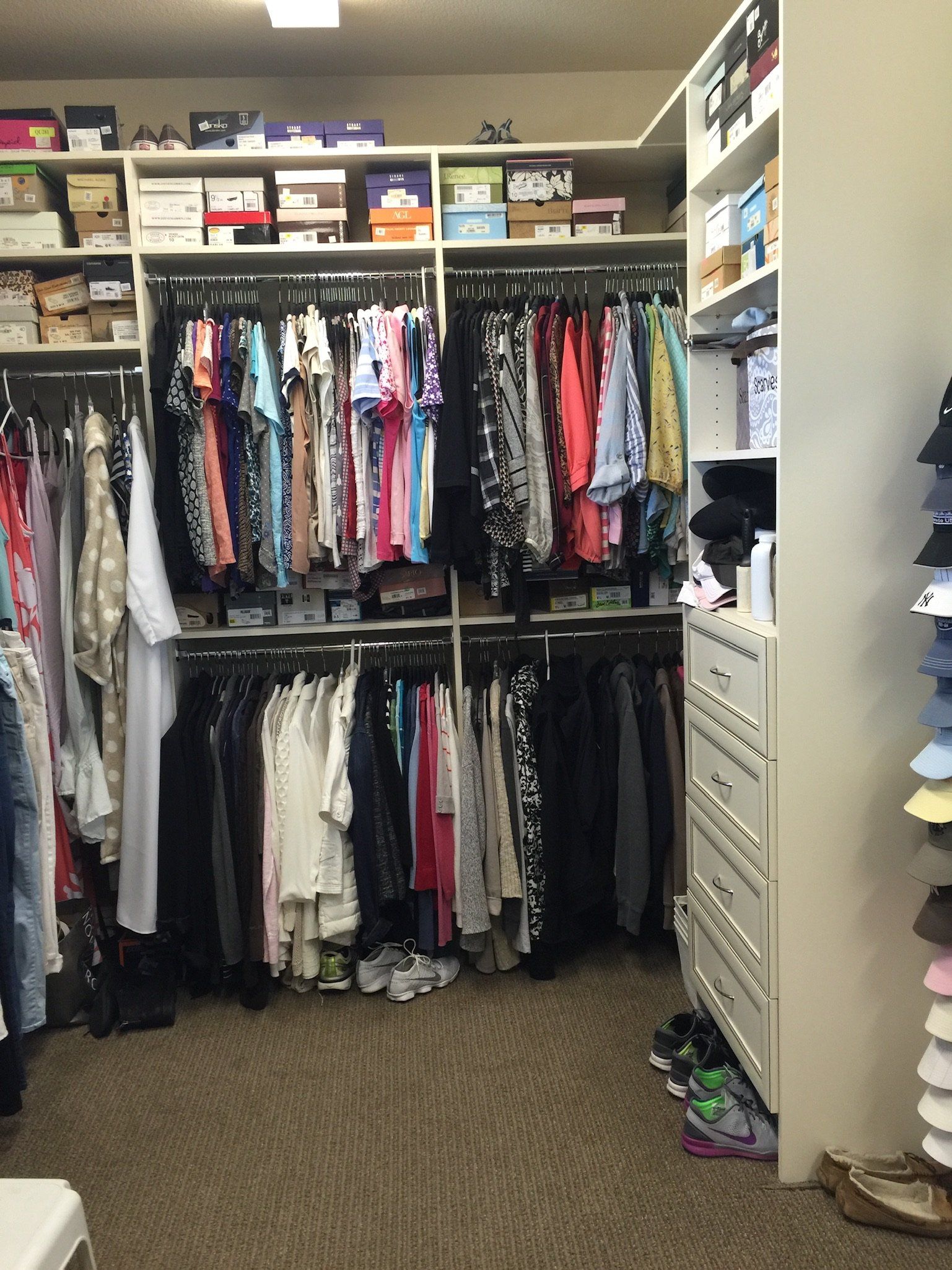 A closet filled with lots of clothes and shoes