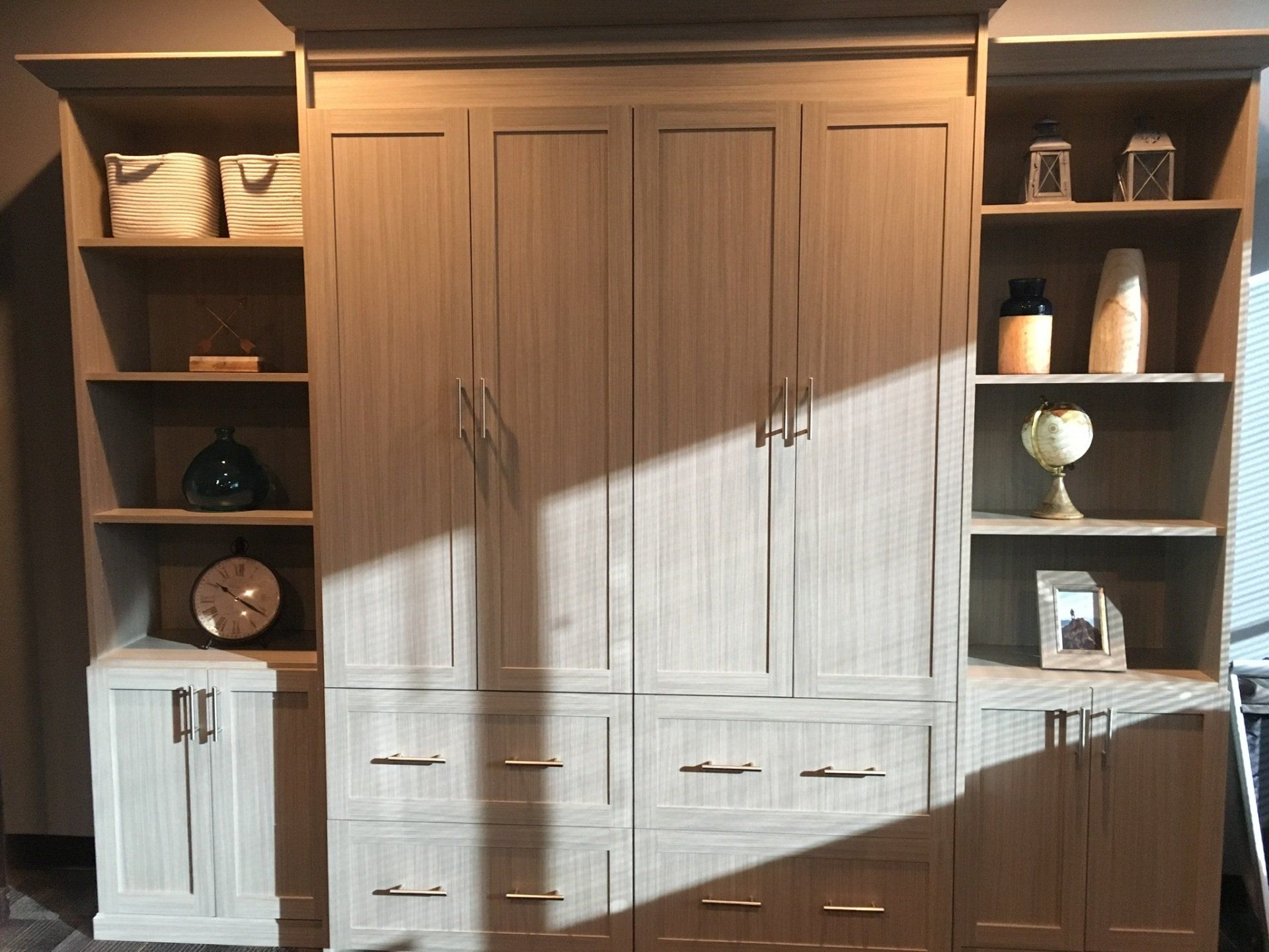 A room with a lot of cabinets and shelves.