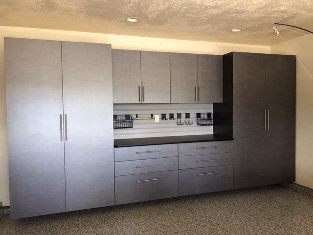 A garage with a lot of cabinets and drawers