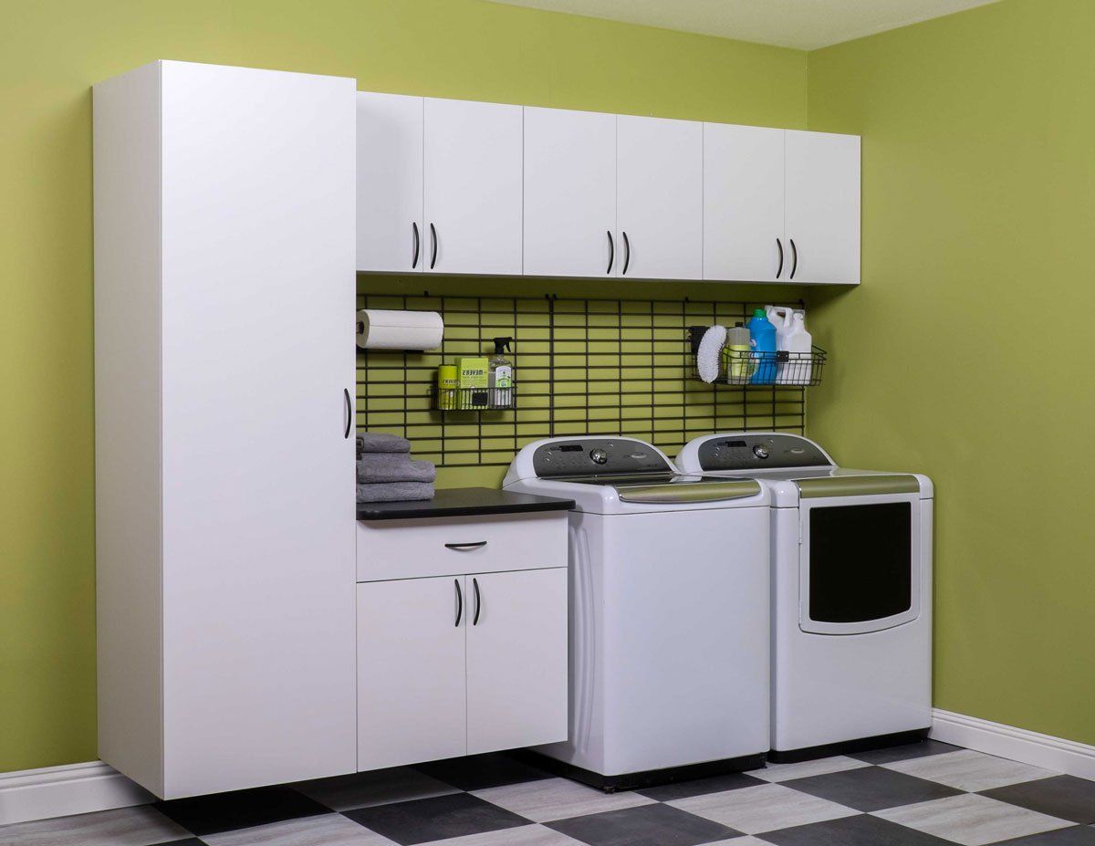 A laundry room with a washer and dryer in it