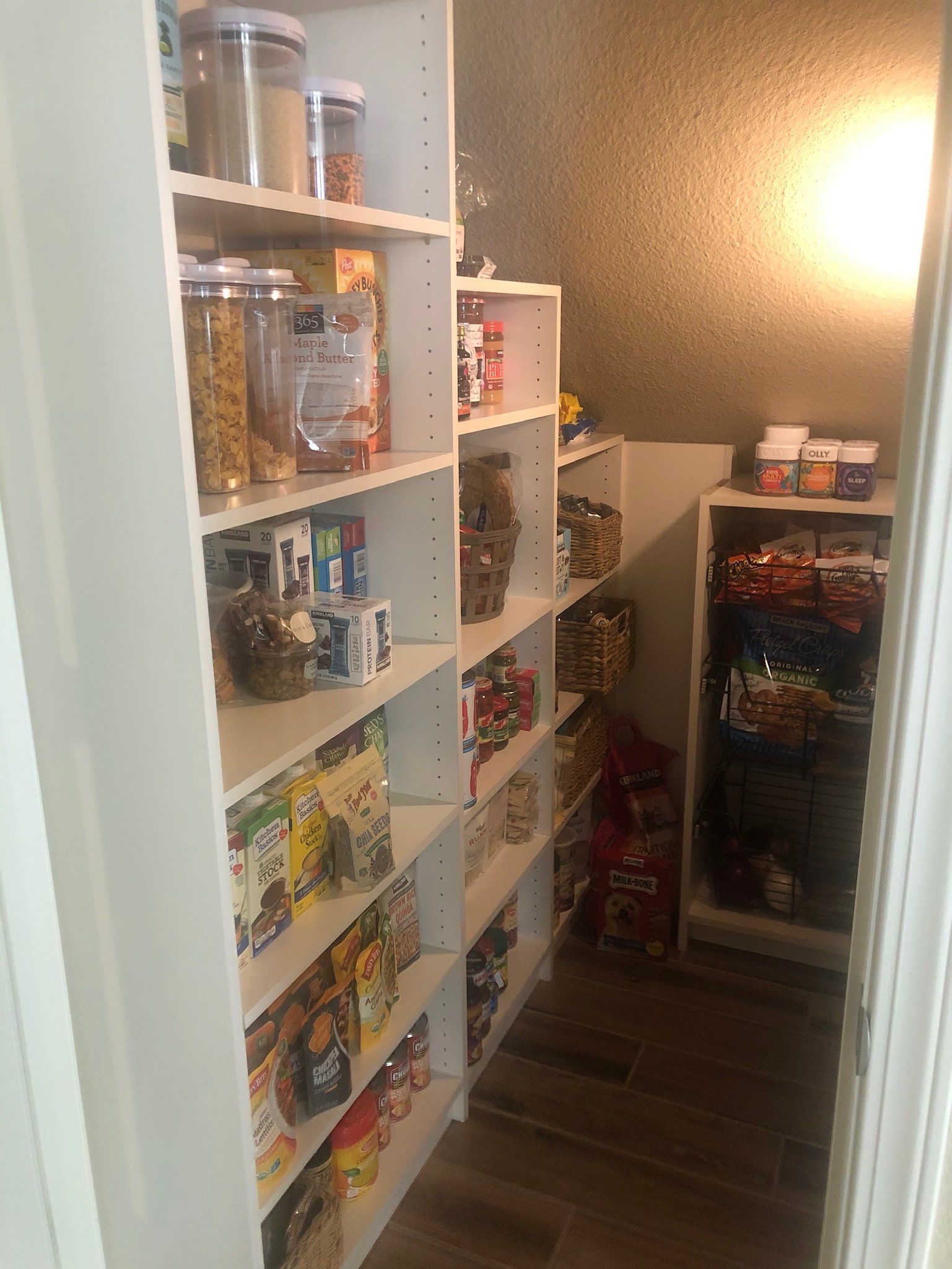 A pantry filled with lots of food on shelves.