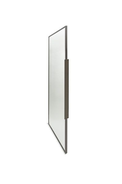 A mirror with a black handle is hanging on a white wall.