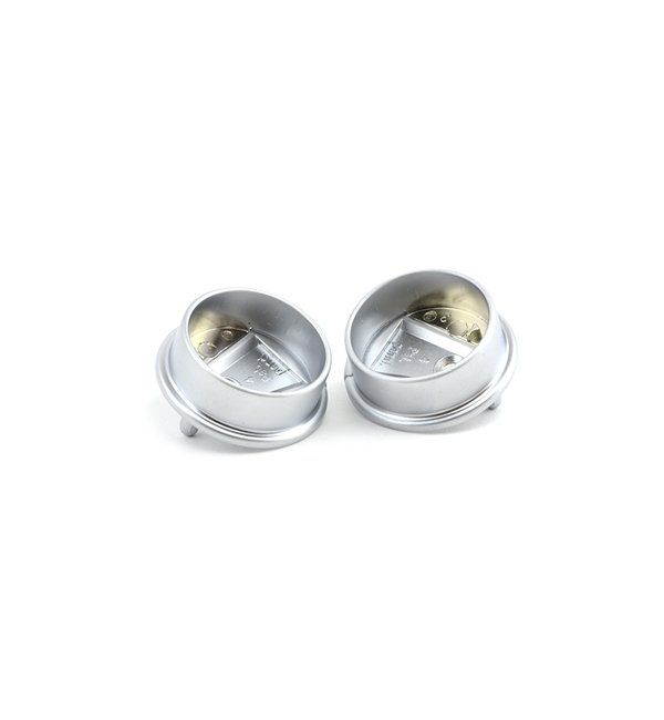 A pair of silver cufflinks on a white background.