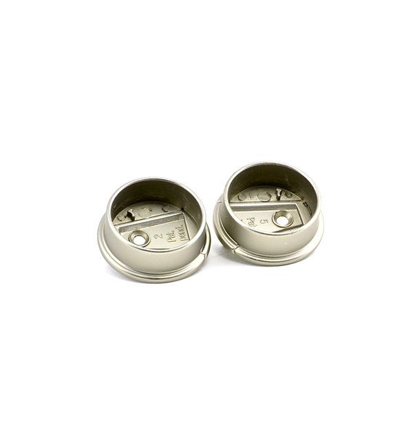 A pair of metal cufflinks on a white background.
