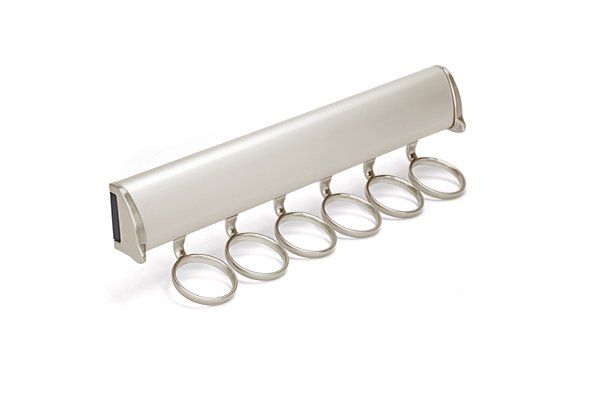 A close up of a tie rack with rings on a white background.