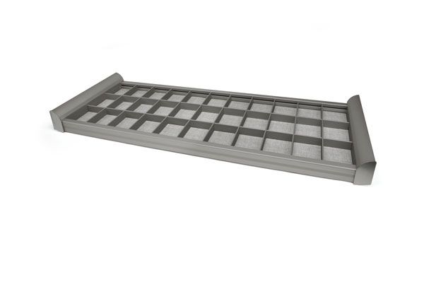 A stainless steel grate with a handle on a white background.
