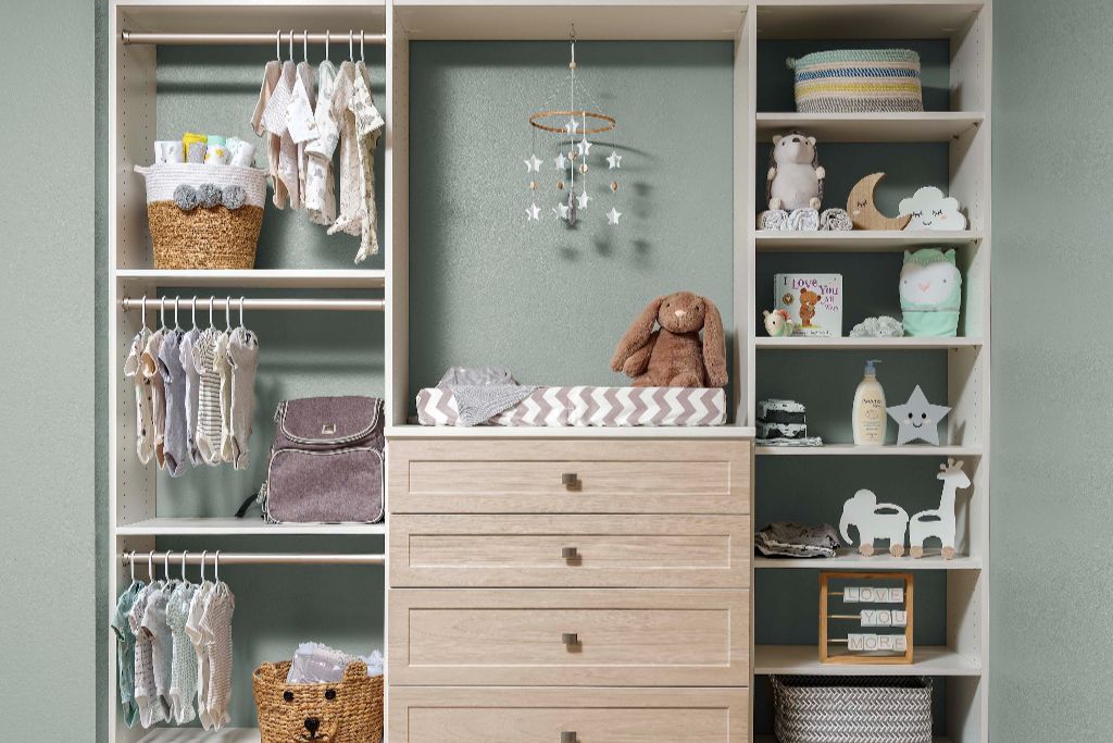 A child 's closet filled with clothes and stuffed animals