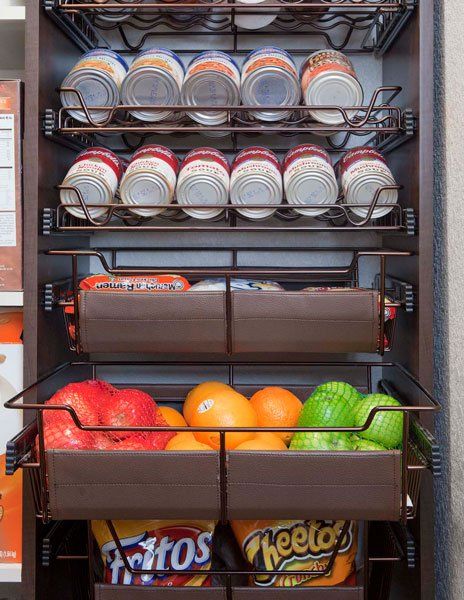 A pantry filled with fruits and snacks including cheetos and fritos.