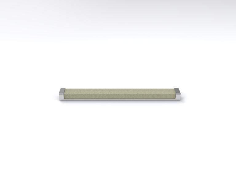 A metal bar is sitting on a white surface.