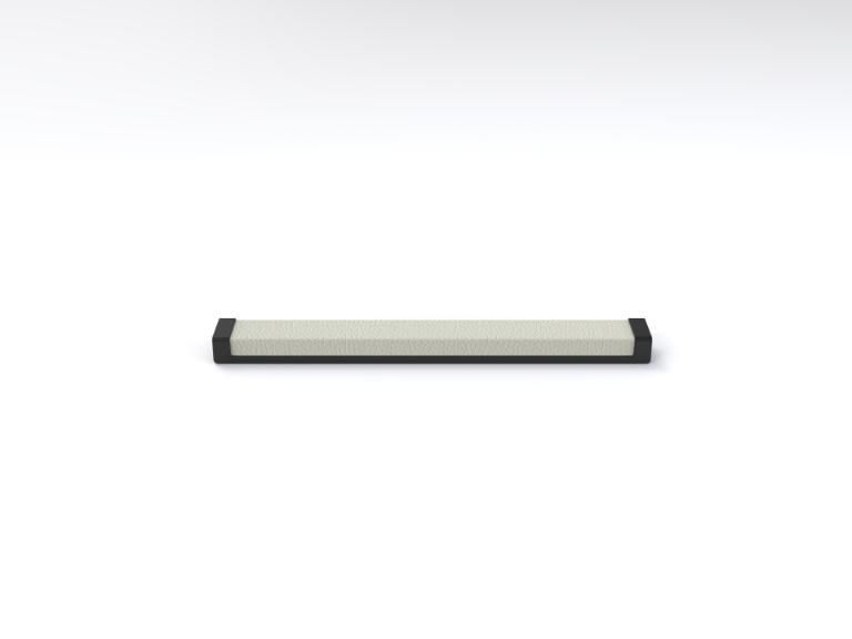 A white bar with a black handle on a white surface.