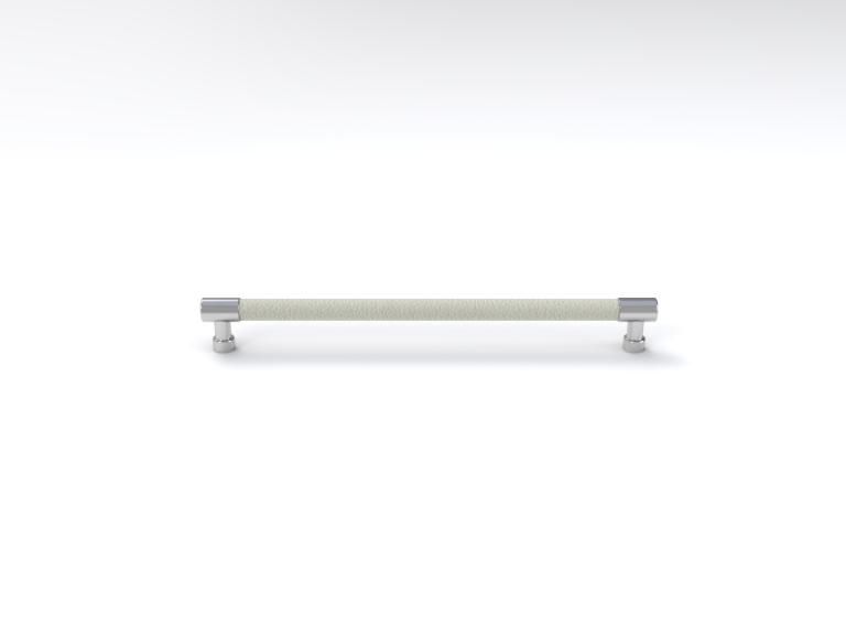 A white handle with a chrome finish on a white surface.