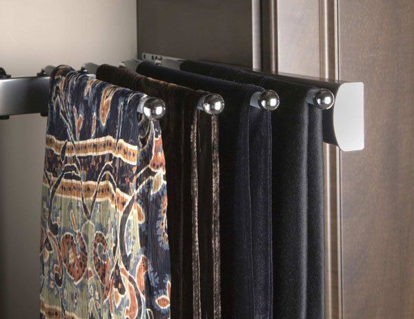 A bunch of scarves are hanging on a rack