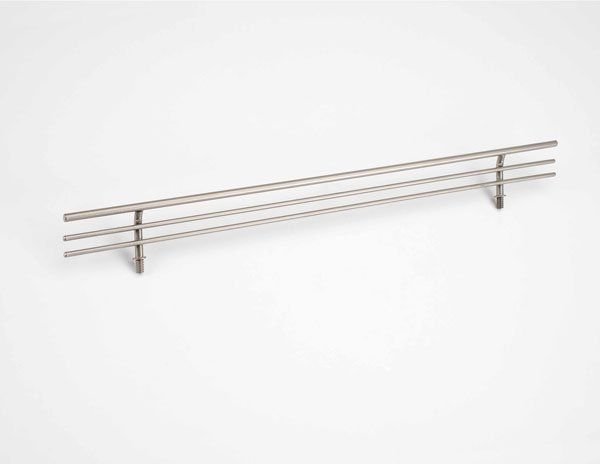 A stainless steel railing is sitting on a white surface.