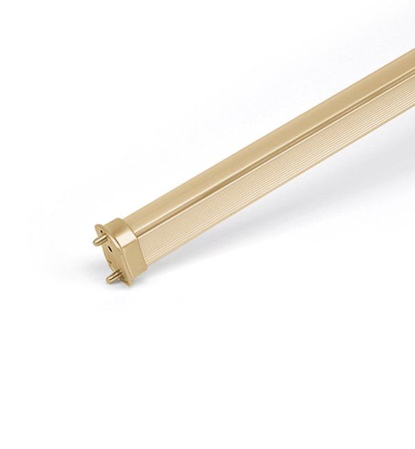 A close up of a metal tube on a white surface.