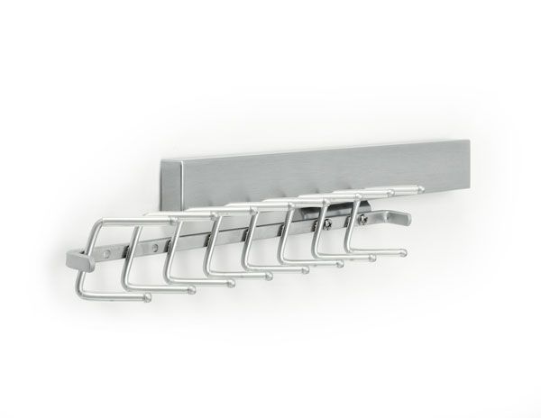 A coat rack with a row of hooks attached to it.