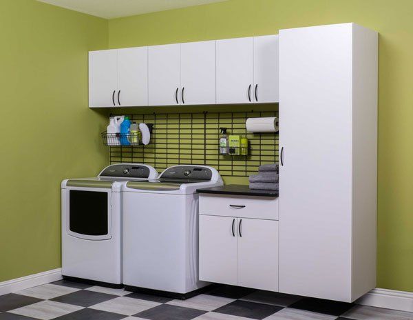A laundry room with a washer and dryer in it
