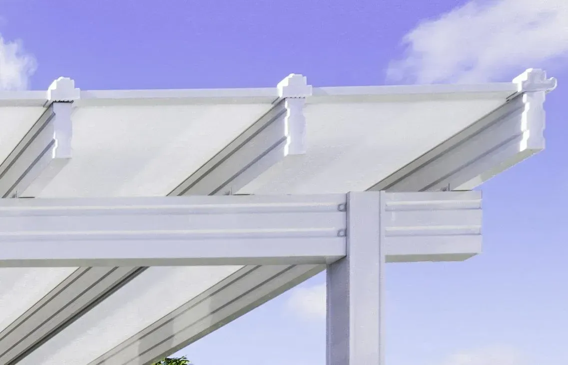 White pergola roof structure against a blue sky