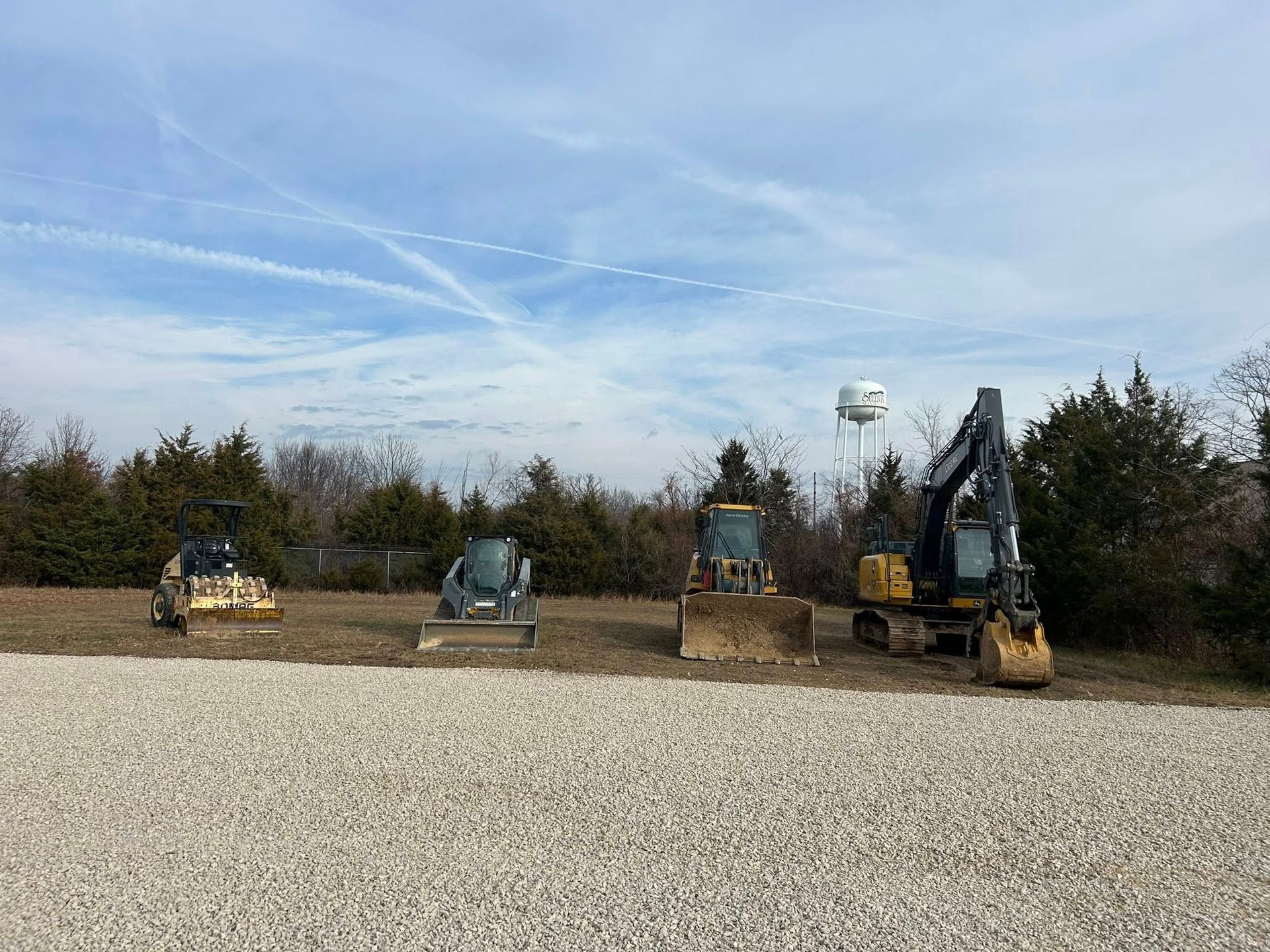 A person holding a baby up in the air indoors near a window, baby smiling.
