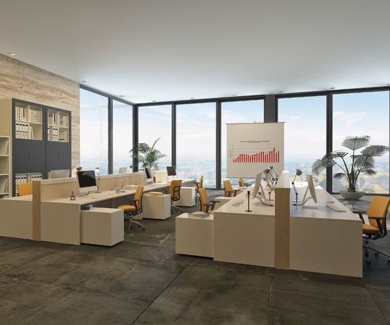 A large office with a lot of windows and tables and chairs