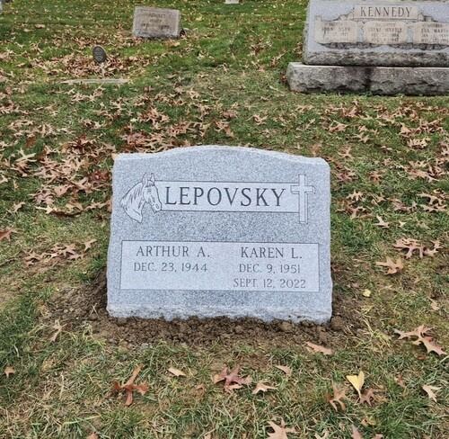 Gray headstone with the name LEPOVSKY and the names and dates for Arthur and Karen. Set in a grassy cemetery.
