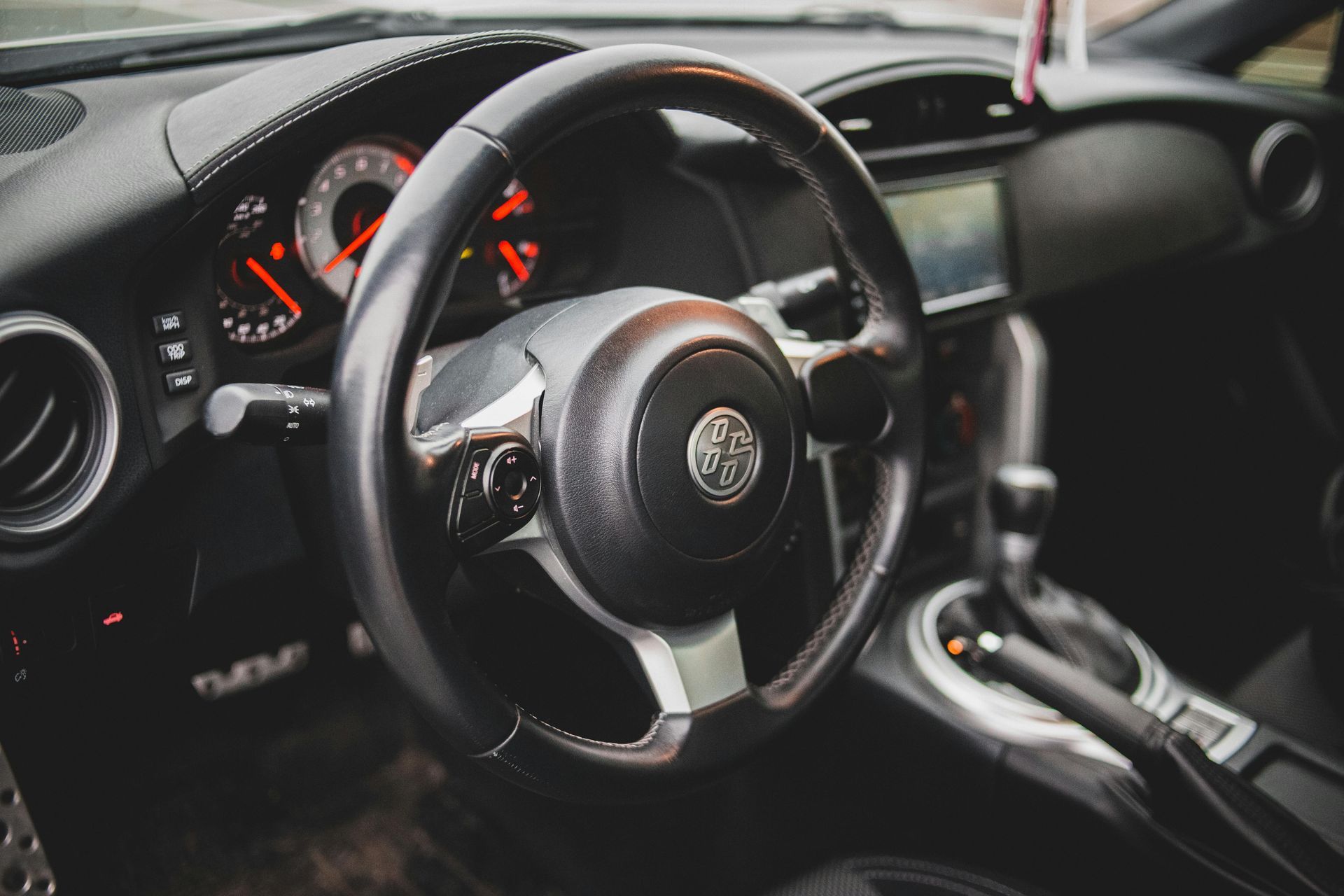 The inside of a car with a steering wheel and dashboard. | RTA Repair