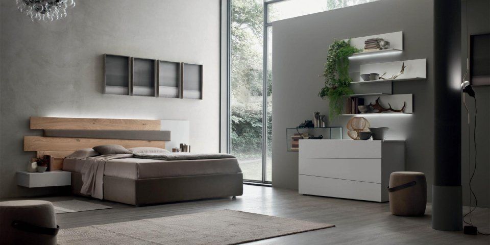 camera da letto con arredi moderni e comò bianco