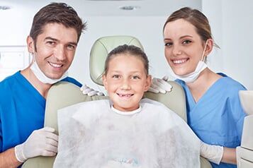 Kid with Dental Staff - Valley Oral Surgeon LTD in Johnstown, PA