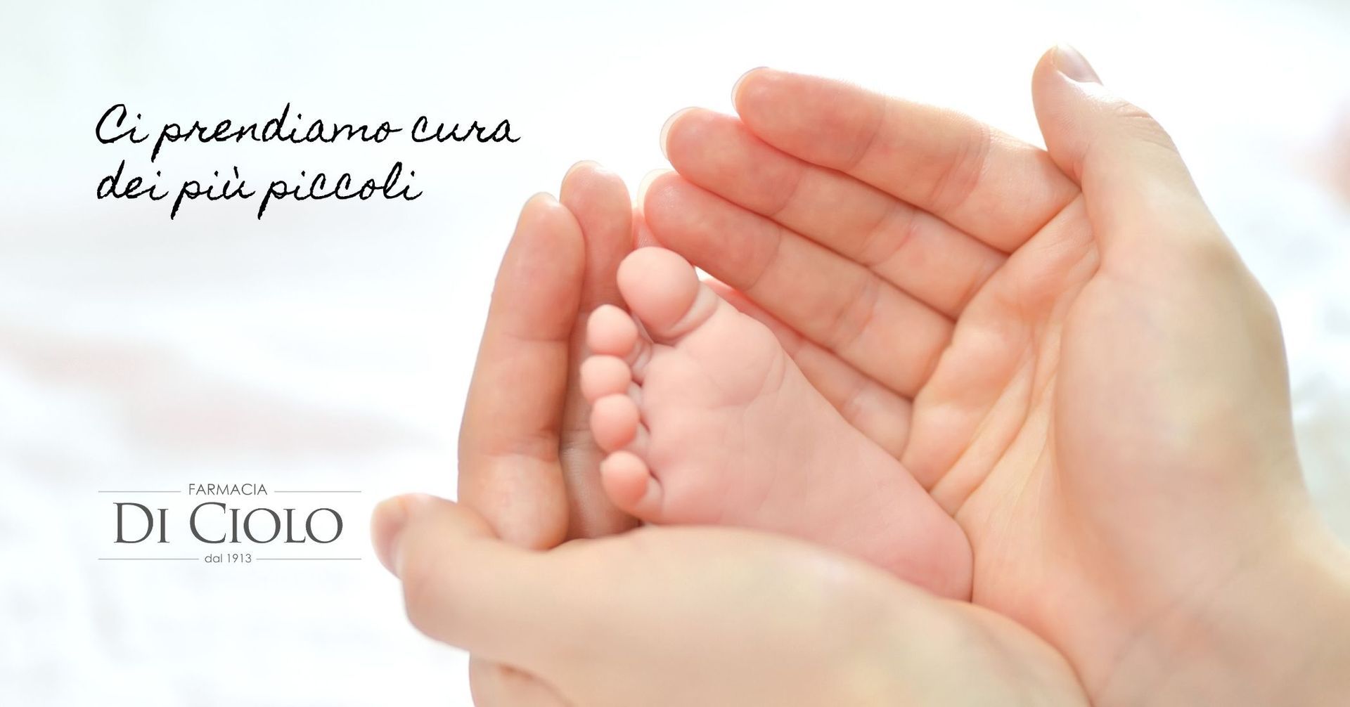 Hands cupping a baby’s foot, with the text