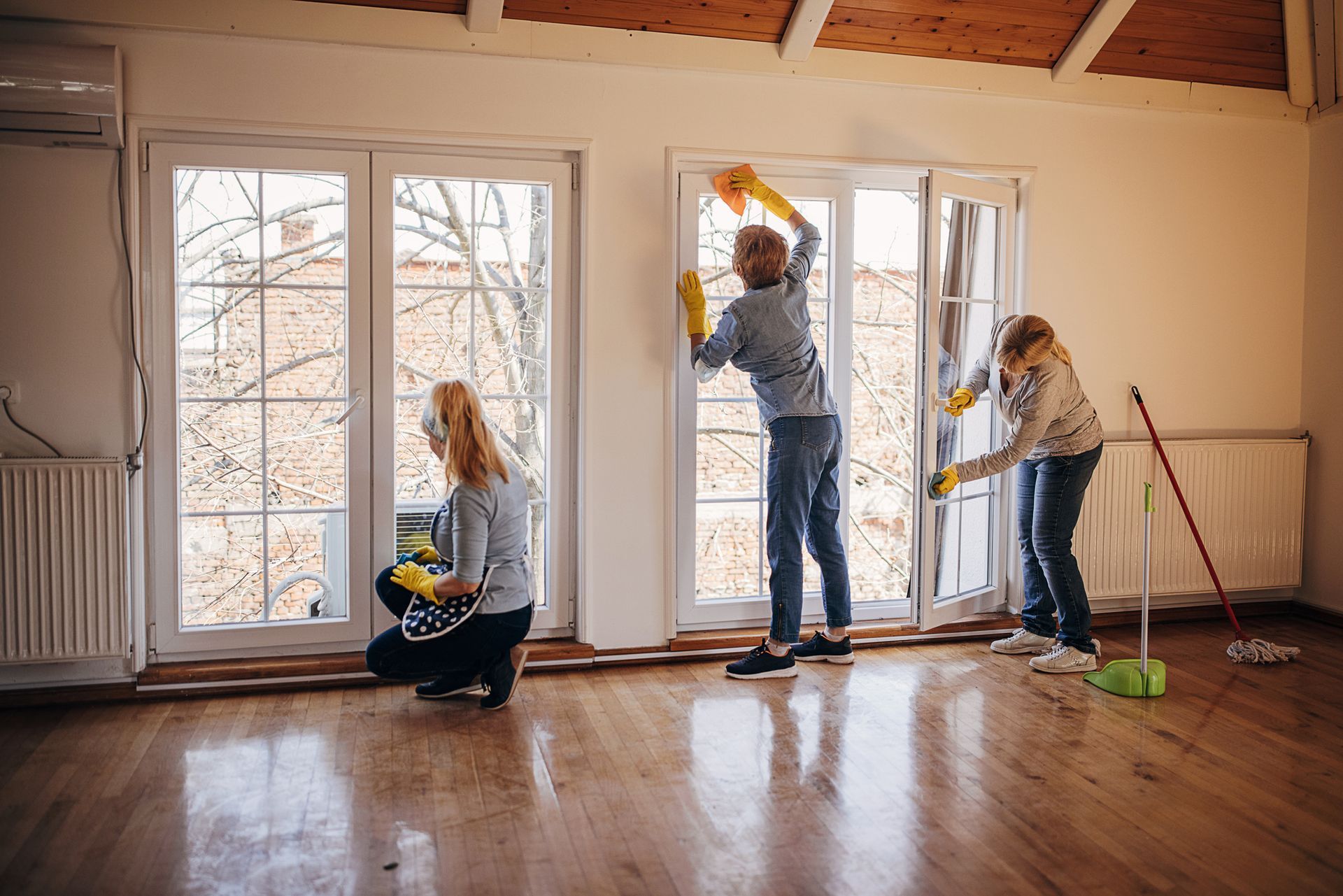 Three Ladies Cleaning Up the Window