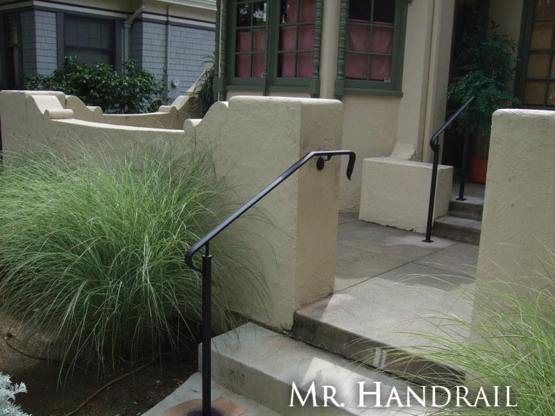 (EX-23) - Handrails make beautiful accent to front entry of mediterranean style office