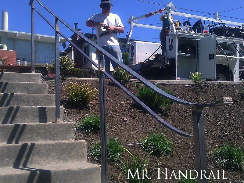 (EX-64) - Finishing construction on arts and crafts handrail