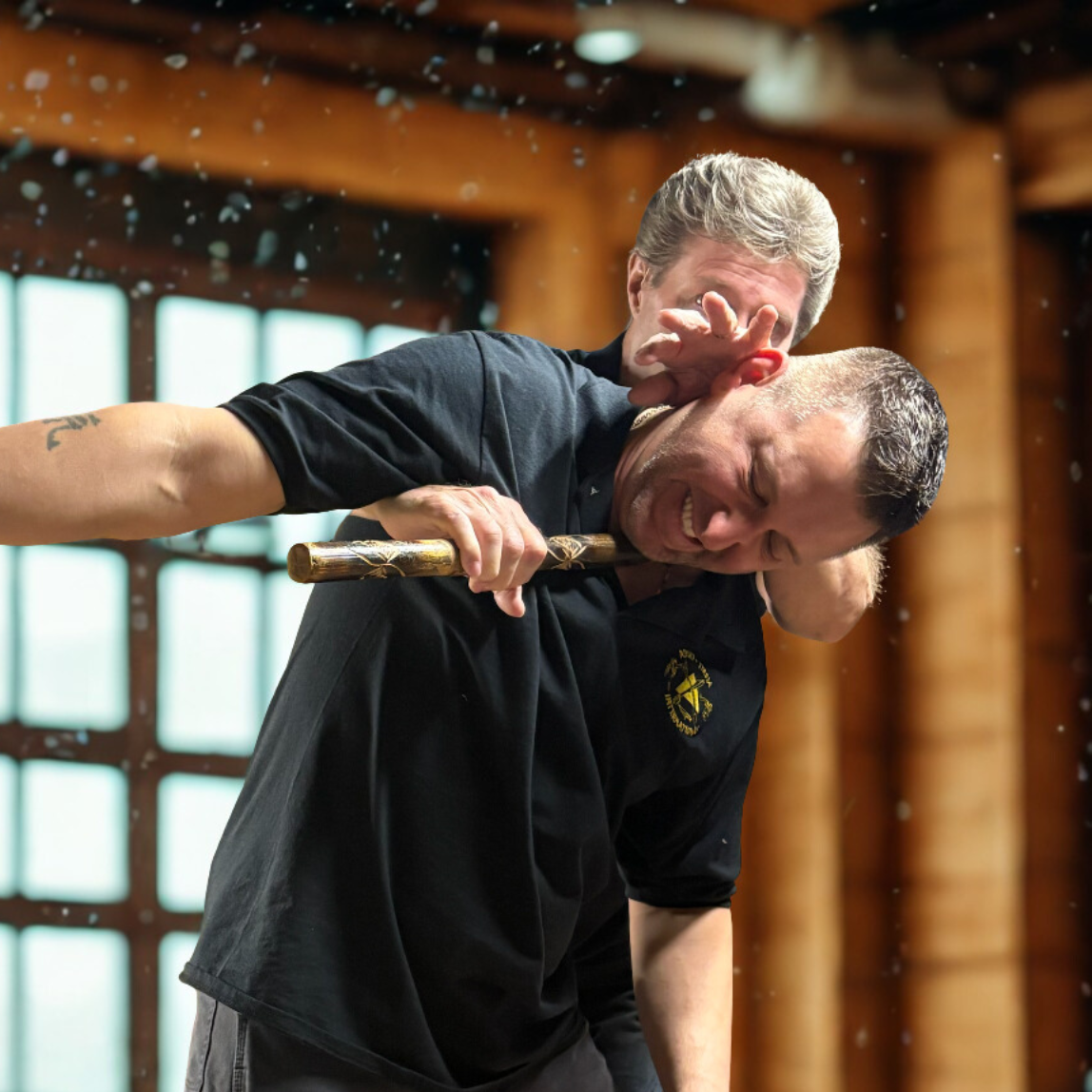 A woman is boxing with a man in a gym
