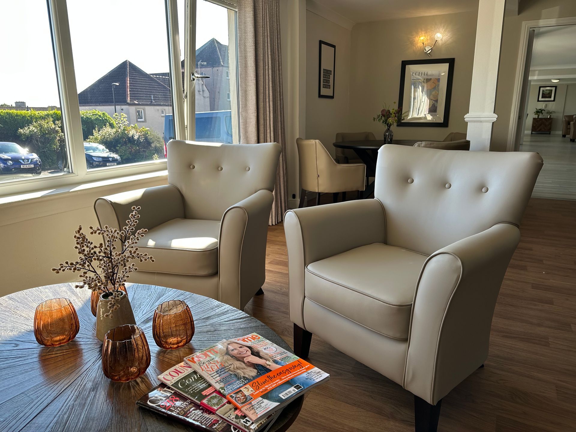 Interior Harbour Care seating area with table and magazines
