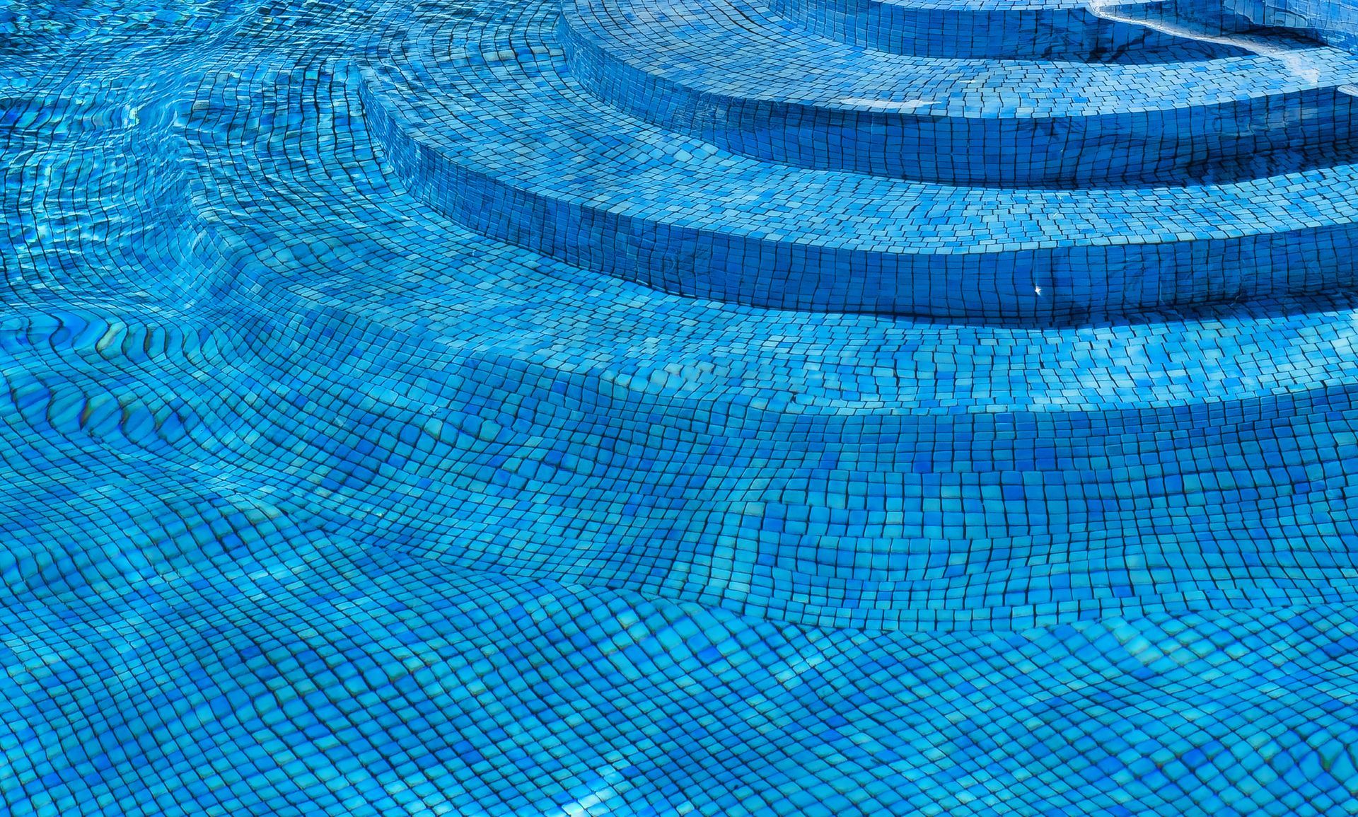 The interior staircase of a full pool.