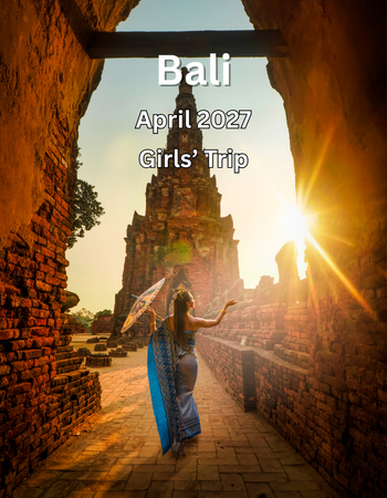 Woman in Bali temple, April 2027. Holding an umbrella with the sun setting behind the temple.