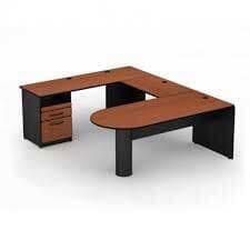 Un escritorio de madera en forma de L con cajones debajo sobre un fondo blanco.