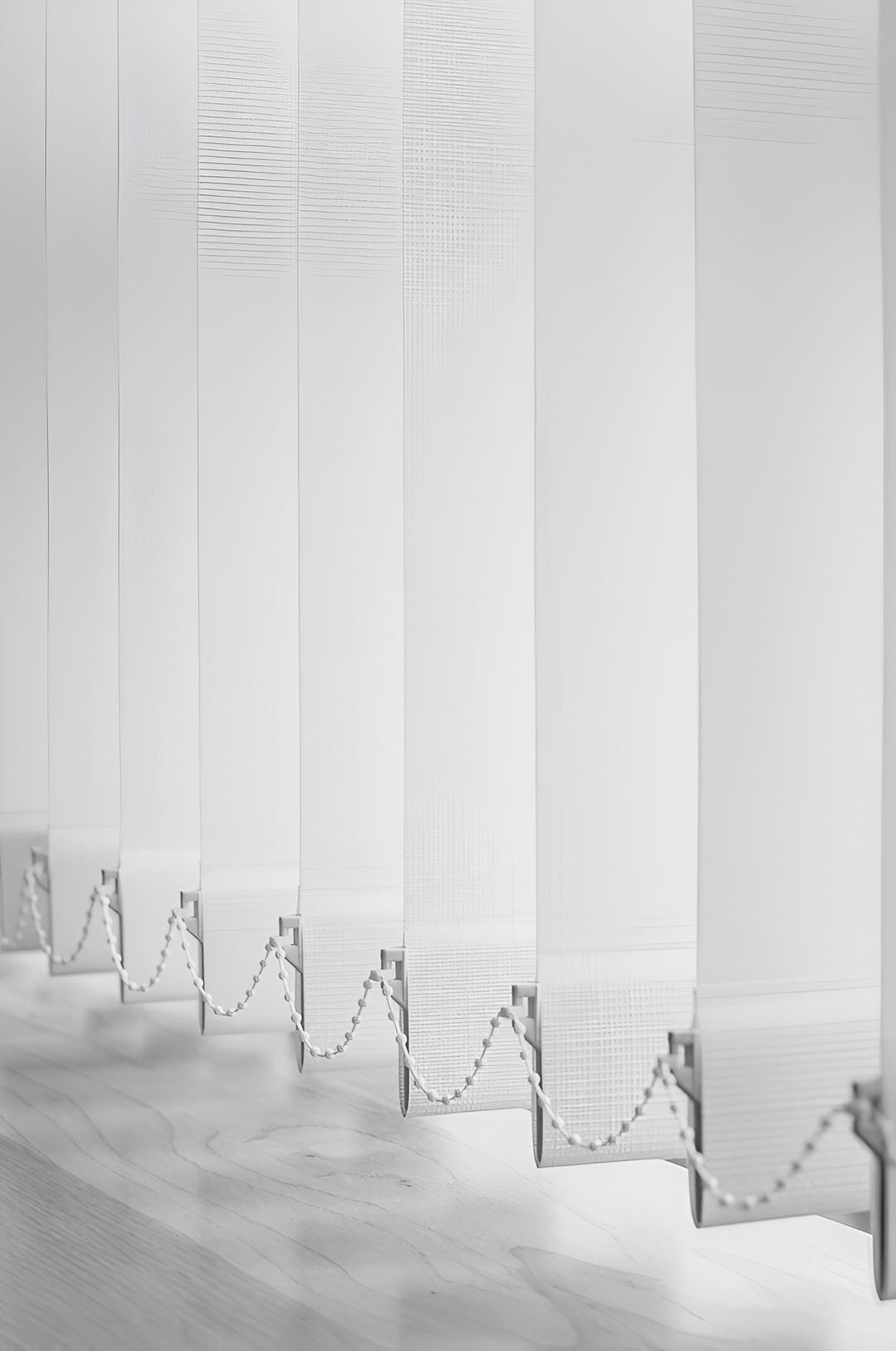 A Row Of White Vertical Blinds In A Room — Ron Ayton Curtains, Blinds & Shutters In Shelly Beach, NSW