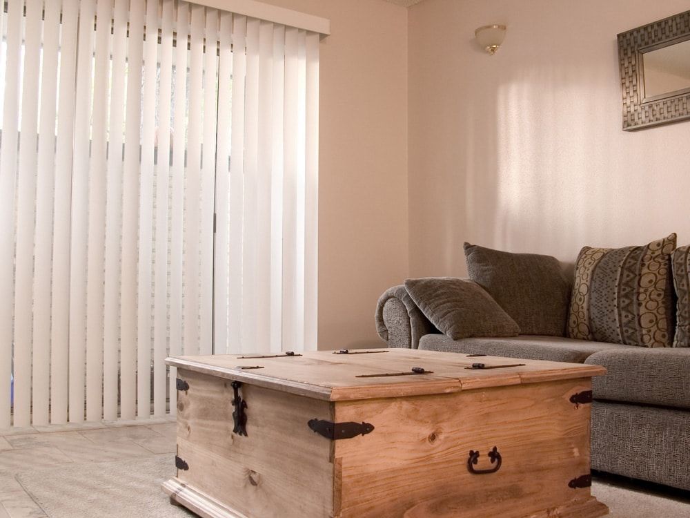 A Living Room With A Couch — Ron Ayton Curtains, Blinds & Shutters In Shelly Beach, NSW