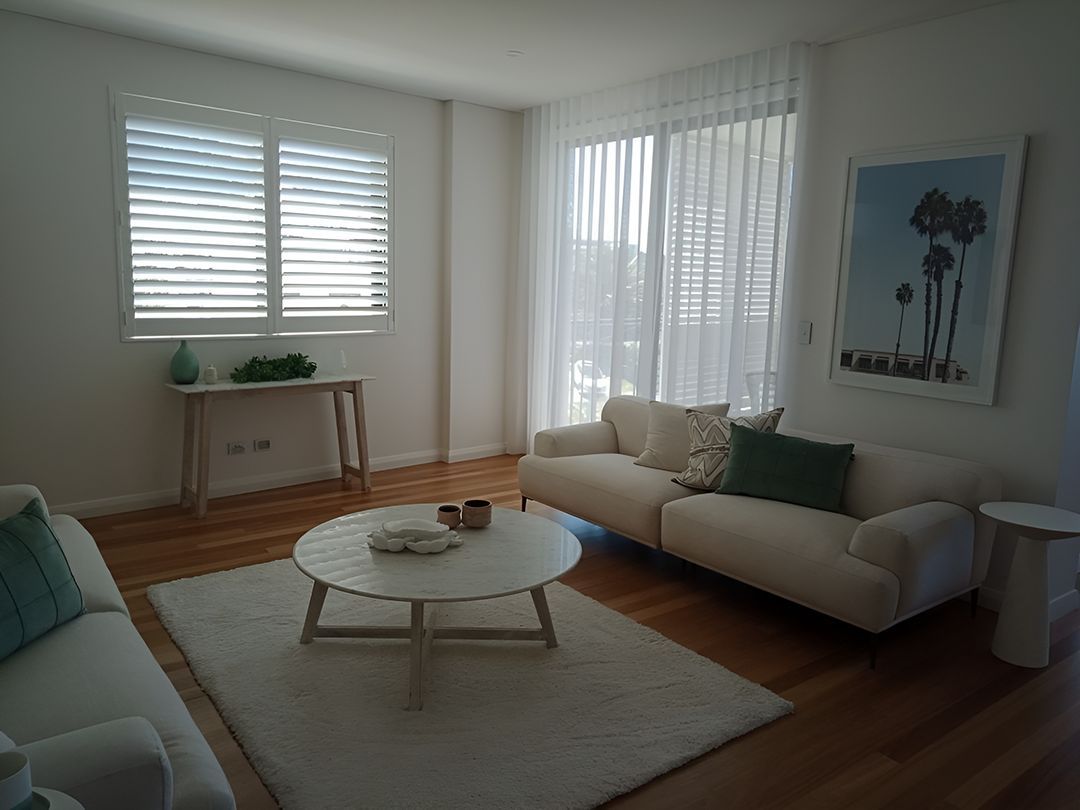 A Living Room With Two Couches And A Coffee Table — Ron Ayton Curtains, Blinds & Shutters In Shelly Beach, NSW