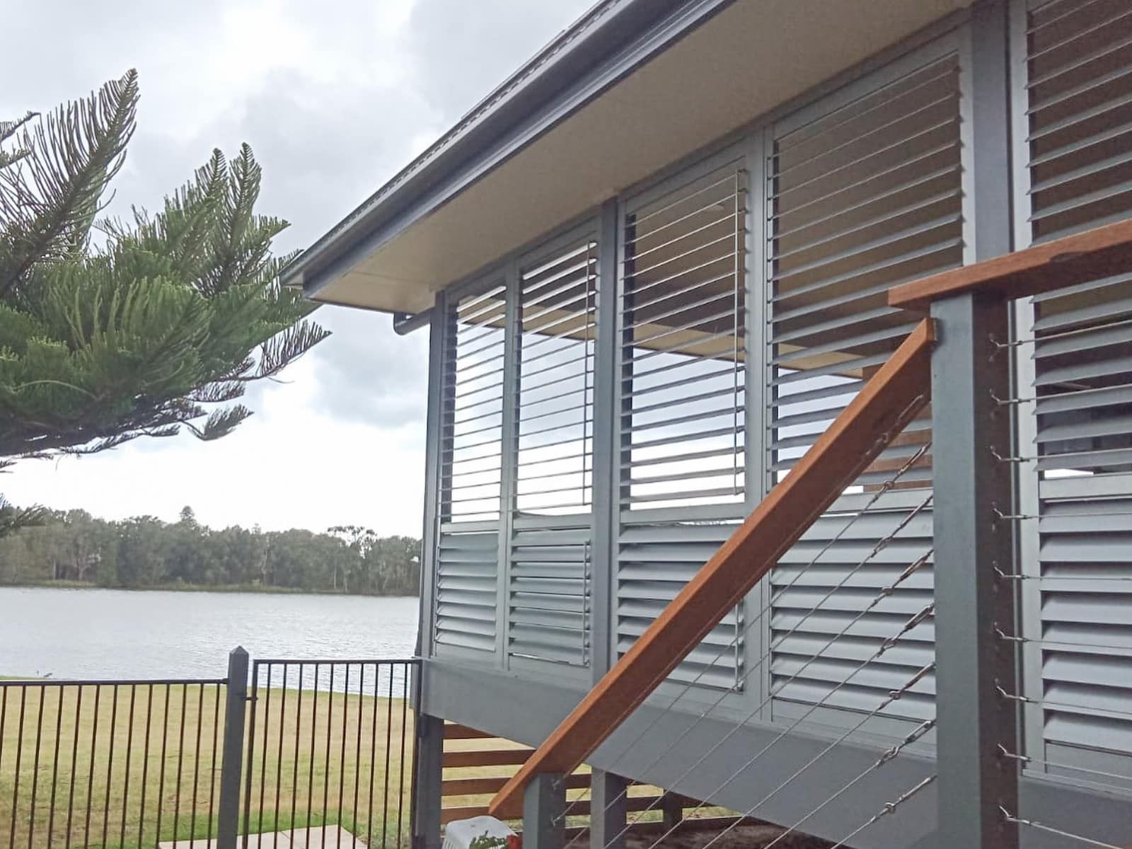 Modern House with Grey Shutters Installed
