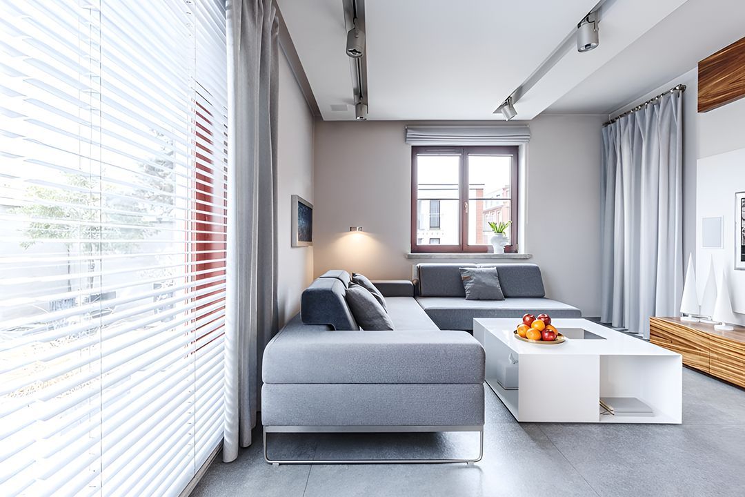 A Living Room With A Couch And A Coffee Table — Ron Ayton Curtains, Blinds & Shutters In Wyee, NSW
