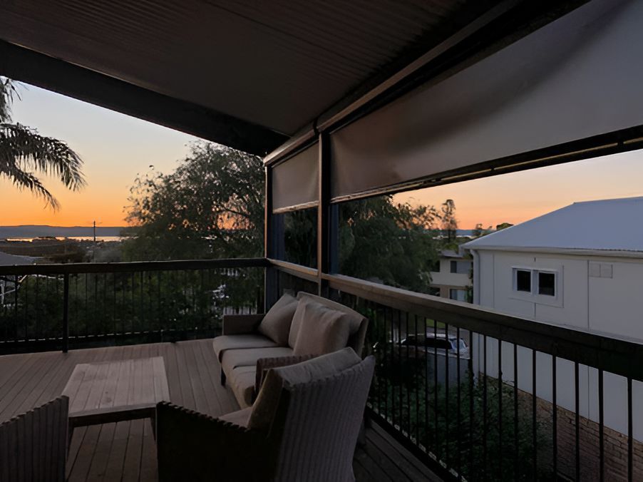 A Room With A Lot Of Windows And Blinds And A Lamp — Ron Ayton Curtains, Blinds & Shutters In Shelly Beach, NSW