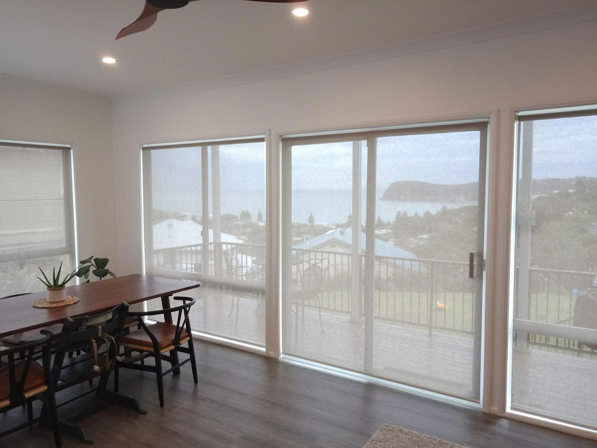 White Roller Blinds On The Dining Area