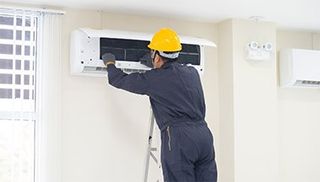 Technician are Repairing Air Conditioner — El Paso, TX — Sun City Air Conditioning Co. Inc.