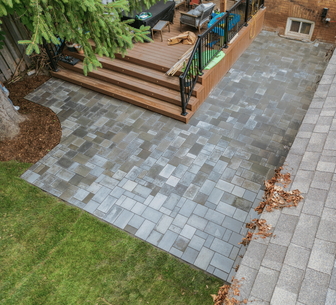 An aerial view of a patio with stairs and a deck.